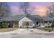 The front exterior shows a single story home with a gray roof, white siding, and blue shutters at 17 Racquet Club Dr., Pawleys Island, SC 29585