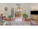 Open living area featuring hardwood flooring, large windows, and views into the adjacent room at 17 Racquet Club Dr., Pawleys Island, SC 29585