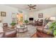 Cozy living room with comfortable leather seating, a ceiling fan, and French doors at 17 Racquet Club Dr., Pawleys Island, SC 29585