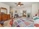 Bright and airy main bedroom featuring carpet, a ceiling fan, and generous closet space at 17 Racquet Club Dr., Pawleys Island, SC 29585