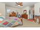 Spacious main bedroom with carpet floors, ceiling fan, and ample closet space at 17 Racquet Club Dr., Pawleys Island, SC 29585