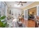 Bright sunroom with skylight, hardwood flooring, a comfortable seating area, and lots of plants at 17 Racquet Club Dr., Pawleys Island, SC 29585