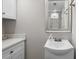 Clean bathroom featuring a modern vanity and mirror, with ample lighting and neutral tones at 1709 S Ocean Blvd. # 510, North Myrtle Beach, SC 29582