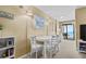 Bright dining area with a white table and seating for six, with views to the ocean and balcony at 1709 S Ocean Blvd. # 510, North Myrtle Beach, SC 29582