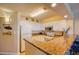 Bright kitchen featuring granite countertops, white cabinetry, and stainless steel appliances at 1903 S Ocean Blvd. # 701, North Myrtle Beach, SC 29582