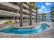 Inviting outdoor lazy river surrounded by palm trees and lounge chairs for a relaxed resort experience at 1903 S Ocean Blvd. # 701, North Myrtle Beach, SC 29582