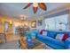 Spacious living room and dining area combo featuring coastal decor and views through the sliding glass doors at 1903 S Ocean Blvd. # 701, North Myrtle Beach, SC 29582