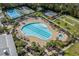 Aerial view showcasing a pool, tennis courts, and well-maintained recreational facilities within a community at 2122 Silver Spring Ln., Myrtle Beach, SC 29577