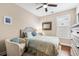 Cozy bedroom features a decorative bed frame, plush pillows, and a ceiling fan for added comfort at 2122 Silver Spring Ln., Myrtle Beach, SC 29577