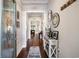 Bright foyer with hardwood floors, decorative mirrors, and an inviting view into the main living areas at 2122 Silver Spring Ln., Myrtle Beach, SC 29577