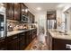 Modern kitchen featuring granite countertops, stainless steel appliances, and dark wood cabinetry at 2122 Silver Spring Ln., Myrtle Beach, SC 29577