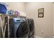 Functional laundry room with shelving and side-by-side washer and dryer at 2122 Silver Spring Ln., Myrtle Beach, SC 29577