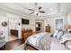 Relaxing main bedroom with ceiling fan, ensuite bath, and natural light at 2122 Silver Spring Ln., Myrtle Beach, SC 29577