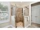 Bathroom featuring tile shower with glass doors and neutral color palette at 2122 Silver Spring Ln., Myrtle Beach, SC 29577