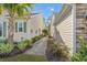 Well-maintained side yard featuring a stone pathway, lush plantings, and tidy landscaping at 2122 Silver Spring Ln., Myrtle Beach, SC 29577