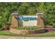 Attractive community entrance sign with stone accents, manicured landscaping, and clear community name at 2122 Silver Spring Ln., Myrtle Beach, SC 29577