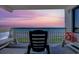 Balcony with a distant ocean sunset, offering stunning views and peaceful relaxation at 2307 S Ocean Blvd. # 5A, North Myrtle Beach, SC 29582