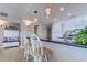 View of a kitchen area with white cabinets and stainless steel appliances, offering a modern look at 2307 S Ocean Blvd. # 5A, North Myrtle Beach, SC 29582