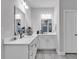 Well-lit bathroom with double sinks, white cabinetry, and modern fixtures at 235 Calhoun Falls Dr., Myrtle Beach, SC 29579