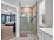 Bathroom featuring a tiled shower with glass door and a view into the bedroom at 235 Calhoun Falls Dr., Myrtle Beach, SC 29579