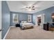 Comfortable bedroom with blue walls, natural light, ceiling fan, and closet at 235 Calhoun Falls Dr., Myrtle Beach, SC 29579