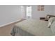 Cozy bedroom featuring neutral colors and a comfortable seating area by the bright window at 235 Calhoun Falls Dr., Myrtle Beach, SC 29579