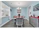 Bright dining room with modern decor, a stylish table set, and large window for natural light at 235 Calhoun Falls Dr., Myrtle Beach, SC 29579