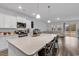 Kitchen island with a quartz countertop, seating, and modern appliances, seamlessly flowing into the living area at 235 Calhoun Falls Dr., Myrtle Beach, SC 29579