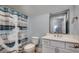 Nautical-themed bathroom with anchor shower curtain, toilet, and a double sink vanity at 2381 Tidewatch Way, North Myrtle Beach, SC 29582