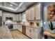 Modern kitchen with stainless appliances, gray cabinets, and granite countertops at 2381 Tidewatch Way, North Myrtle Beach, SC 29582