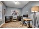 Home office with natural light, wood floors, and black filing cabinets at 2381 Tidewatch Way, North Myrtle Beach, SC 29582