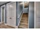 Carpeted staircase with white trim, adjacent to a closet, leading to the upper level at 2381 Tidewatch Way, North Myrtle Beach, SC 29582