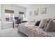 Comfortable bedroom with a desk by the window, decorated with cacti wall art for a relaxing and stylish space at 2408 Blue Crane Circle, Myrtle Beach, SC 29577