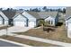 Inviting single-Gathering home with a two-car garage, blue siding, and mature palm tree in the front yard at 2408 Blue Crane Circle, Myrtle Beach, SC 29577