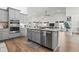 Open kitchen design featuring stainless steel appliances, hardwood floors and an eat-in island at 2408 Blue Crane Circle, Myrtle Beach, SC 29577