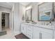 Elegant bathroom featuring double vanity with marble countertop and fixtures at 2409 Silkgrass Ln., Myrtle Beach, SC 29579