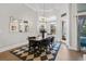 Elegant dining area boasts ample natural light, stylish chandelier, and a cozy atmosphere at 2409 Silkgrass Ln., Myrtle Beach, SC 29579