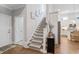 Bright staircase with carpeted steps, leading to the upper level, next to the kitchen at 2409 Silkgrass Ln., Myrtle Beach, SC 29579