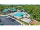 Aerial view of the community pool, clubhouse, parking lot, and seating areas at 2557 Pete Dye Dr. # 702, North Myrtle Beach, SC 29582