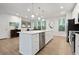 Well-lit kitchen with stainless steel appliances, lots of counter space, and light wood flooring at 2557 Pete Dye Dr. # 702, North Myrtle Beach, SC 29582