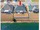 Aerial view of a home with a fenced backyard, lake view, and patio at 257 Leste Rd., Myrtle Beach, SC 29588