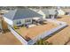 Aerial view of a home's backyard with white picket fence and pergola over patio area at 257 Leste Rd., Myrtle Beach, SC 29588