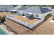 Aerial view of a home's backyard with white picket fence and pergola over patio area at 257 Leste Rd., Myrtle Beach, SC 29588