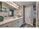 Bathroom with white cabinets, a large mirror, and plenty of counter space at 257 Leste Rd., Myrtle Beach, SC 29588