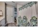 Well-lit bathroom featuring a decorative shower curtain and neutral walls at 257 Leste Rd., Myrtle Beach, SC 29588