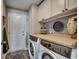 Efficient laundry room with front load washer and dryer and ample counter space at 257 Leste Rd., Myrtle Beach, SC 29588