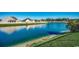 Beautiful view of a tranquil pond with clear water, surrounded by lush greenery and neighborhood homes at 257 Leste Rd., Myrtle Beach, SC 29588