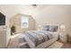 Charming bedroom featuring natural light, neutral walls, a plush rug, and stylish modern furniture at 2960 Tigers Eye Rd., Little River, SC 29566