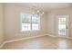 Bright dining area with tile floor, large window, and access to the backyard at 2960 Tigers Eye Rd., Little River, SC 29566