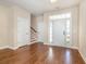 Welcoming foyer with hardwood floors, a staircase, and ample natural light at 2960 Tigers Eye Rd., Little River, SC 29566